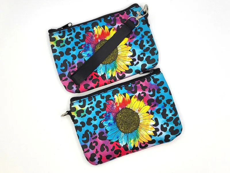 Two colorful bags with leopard print and sunflower design on a white background