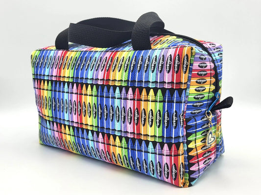 Crayon print zipper duffle bag, front view — colorful handmade craft notions bag