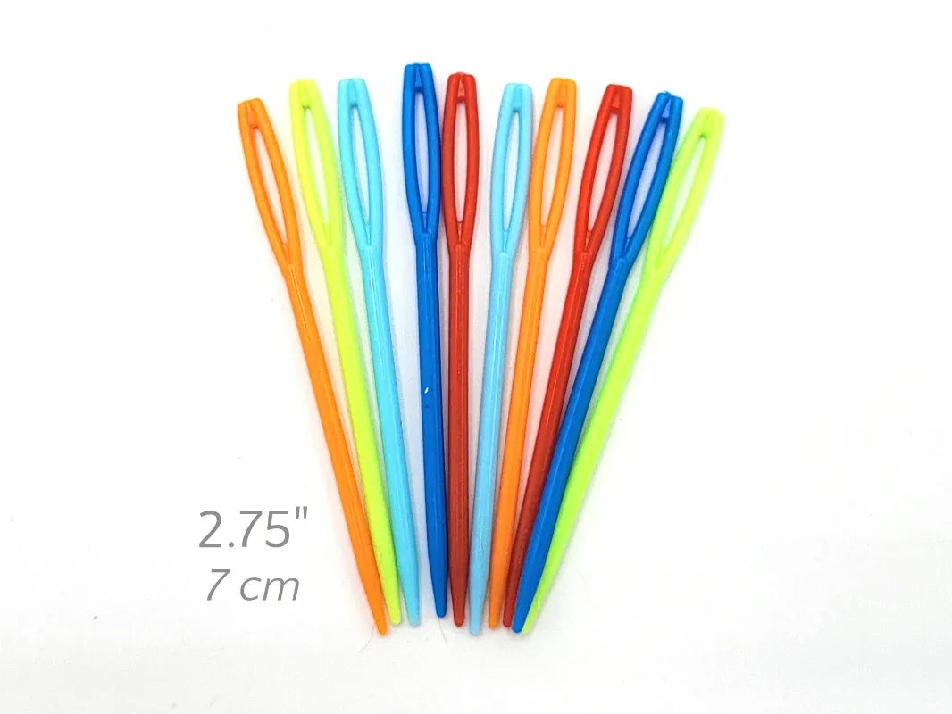 Set of colorful plastic needles on a white background with measurement text.