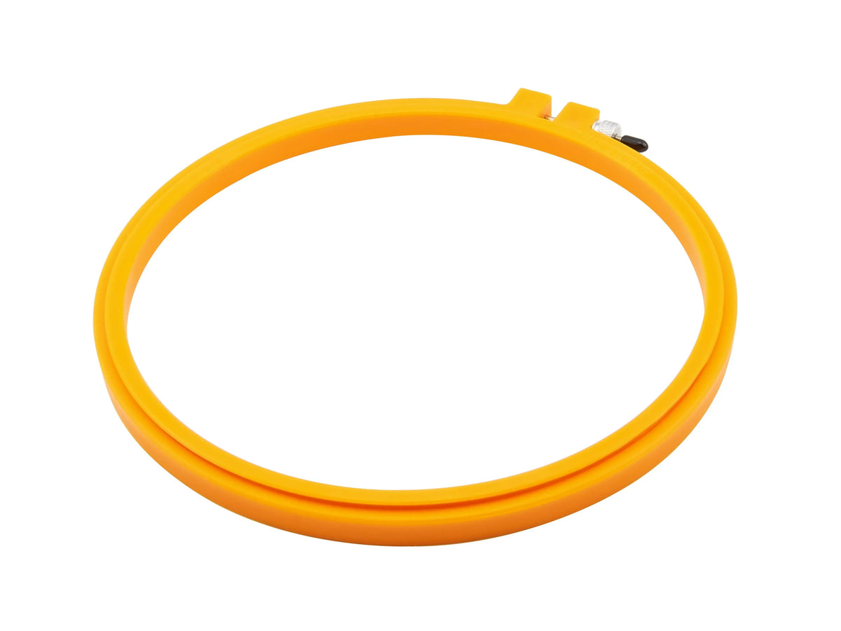 Orange embroidery hoop on a white background