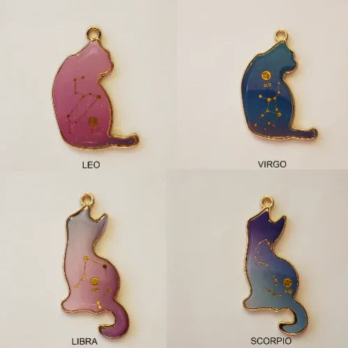 Four cat-shaped zodiac pendants on a light gray background