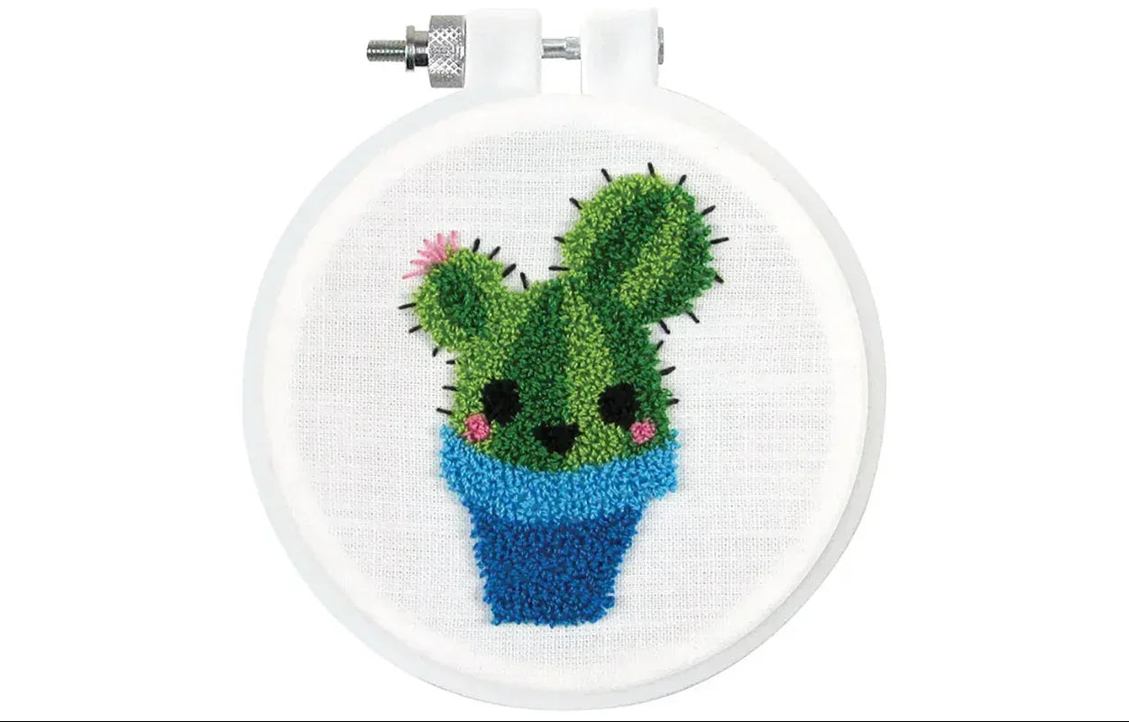 Embroidery hoop with a cactus design on a white background