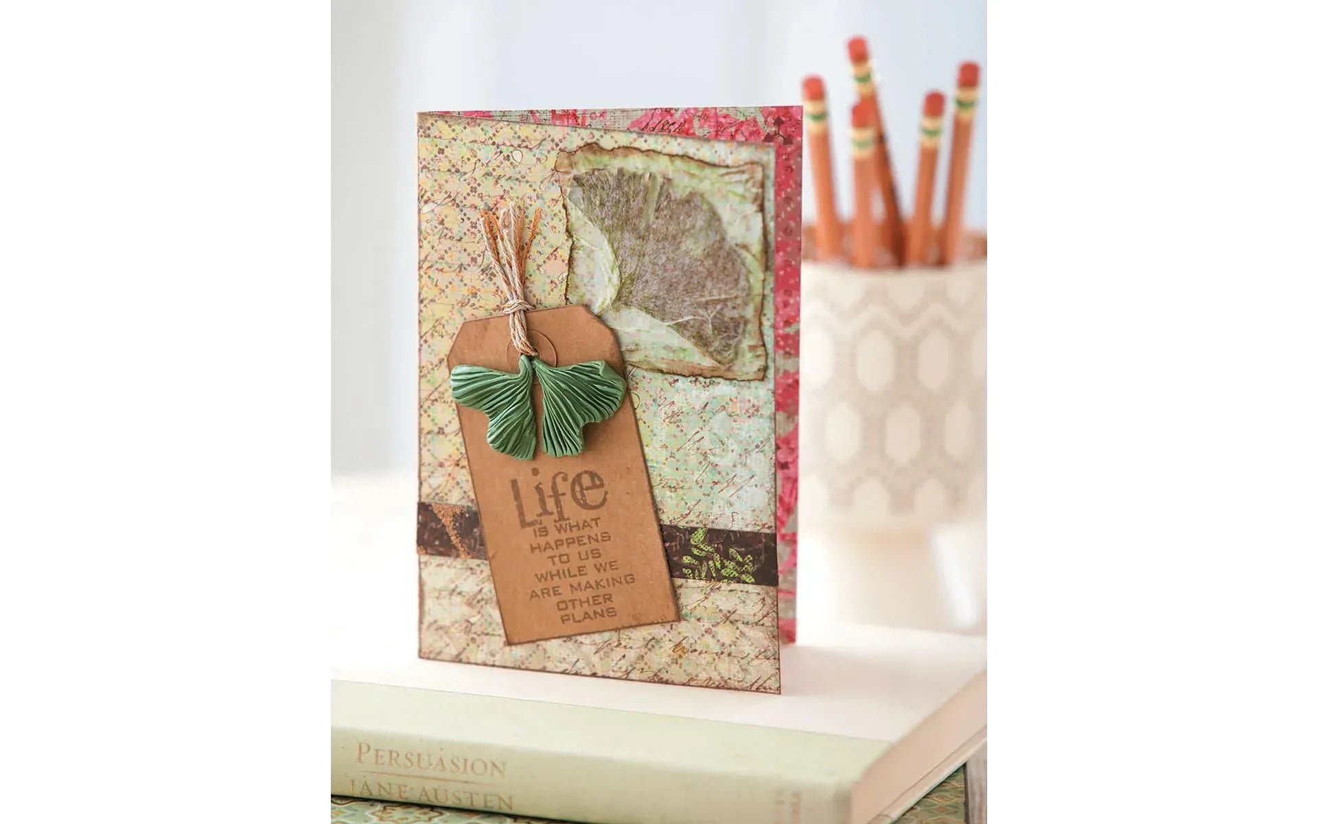 Decorative card with 'Life' tag and map design on a white surface
