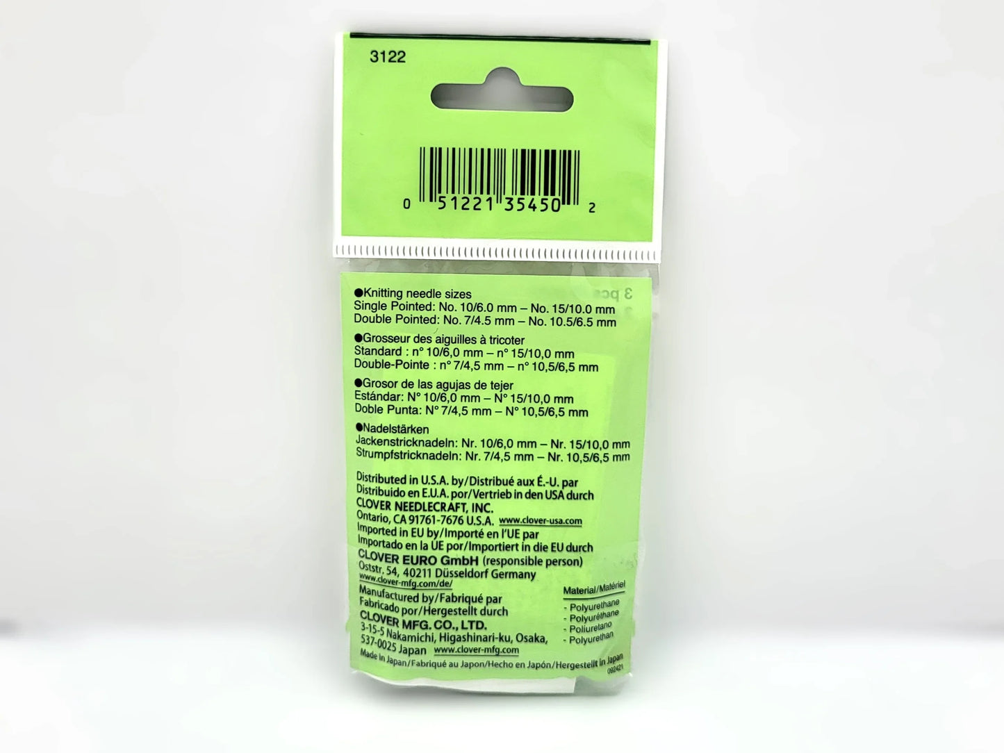 Green packaging with text and a barcode on a white background