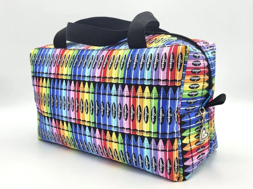 Crayon print zipper duffle bag, front view — colorful handmade craft notions bag