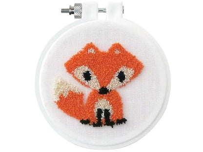 Embroidery hoop with a fox design on a white background