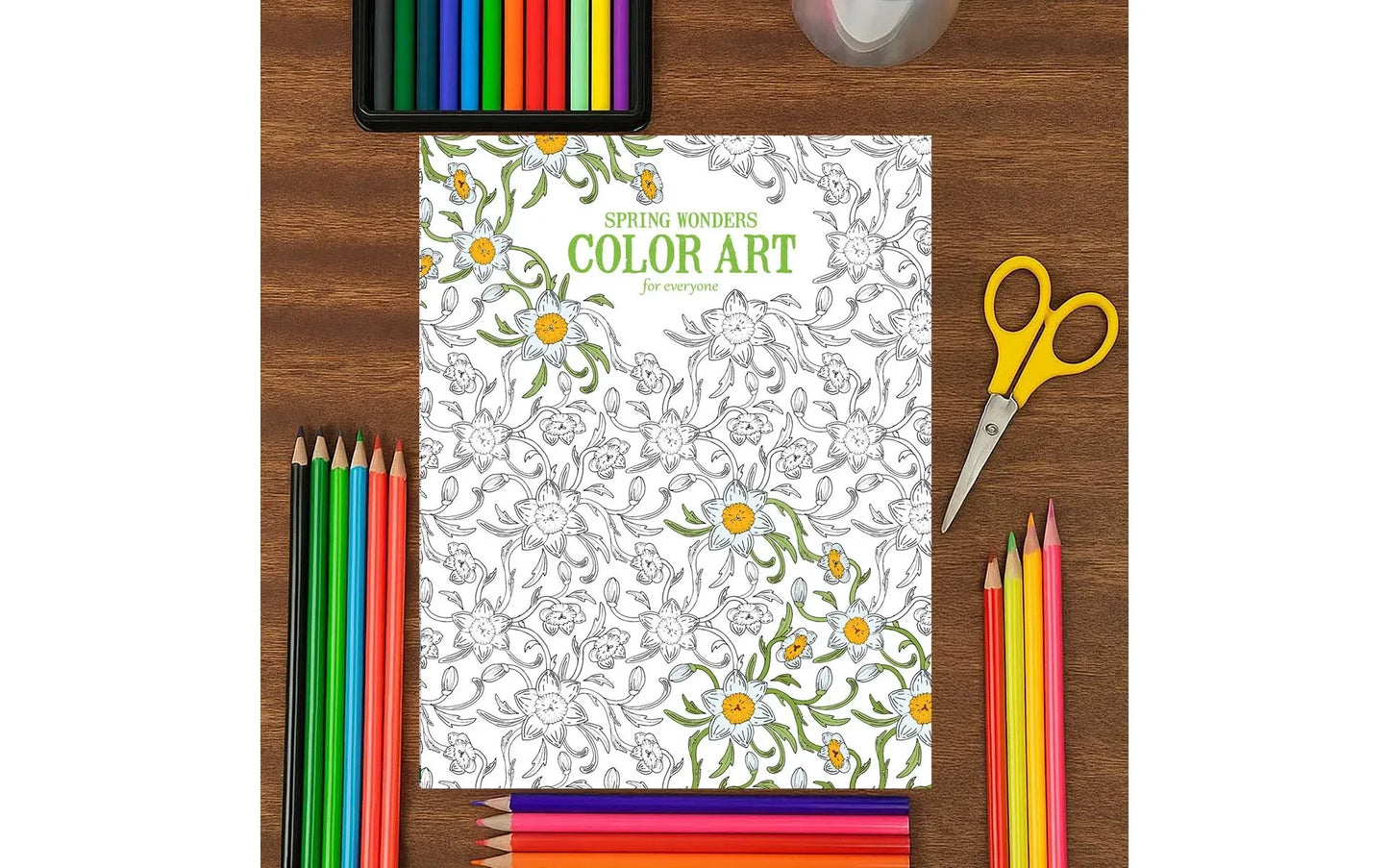 Coloring book titled 'Spring Wonders' with coloring supplies on a wooden surface
