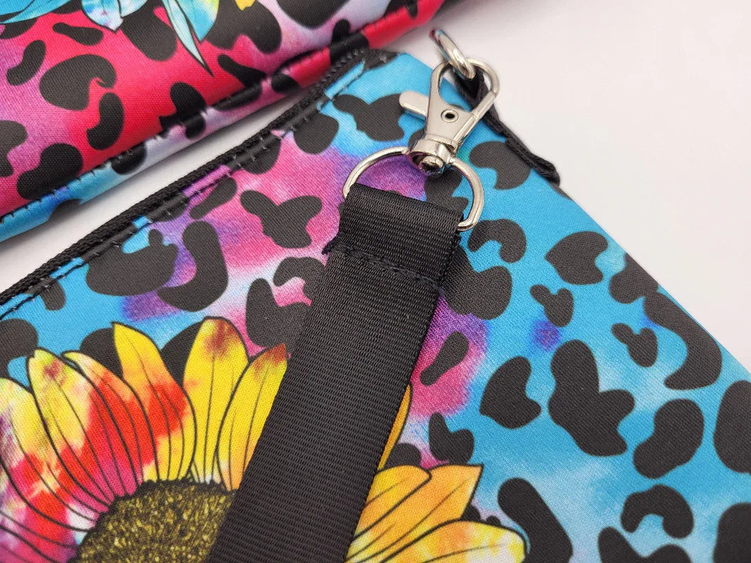 Colorful pouch with floral and leopard print design on a white background