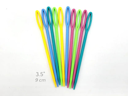 Set of colorful knitting needles on a white background with measurement text.