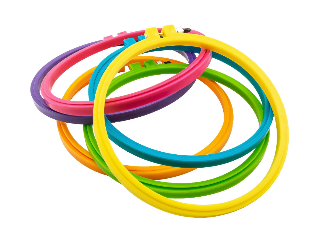 Set of colorful embroidery hoops on a white background
