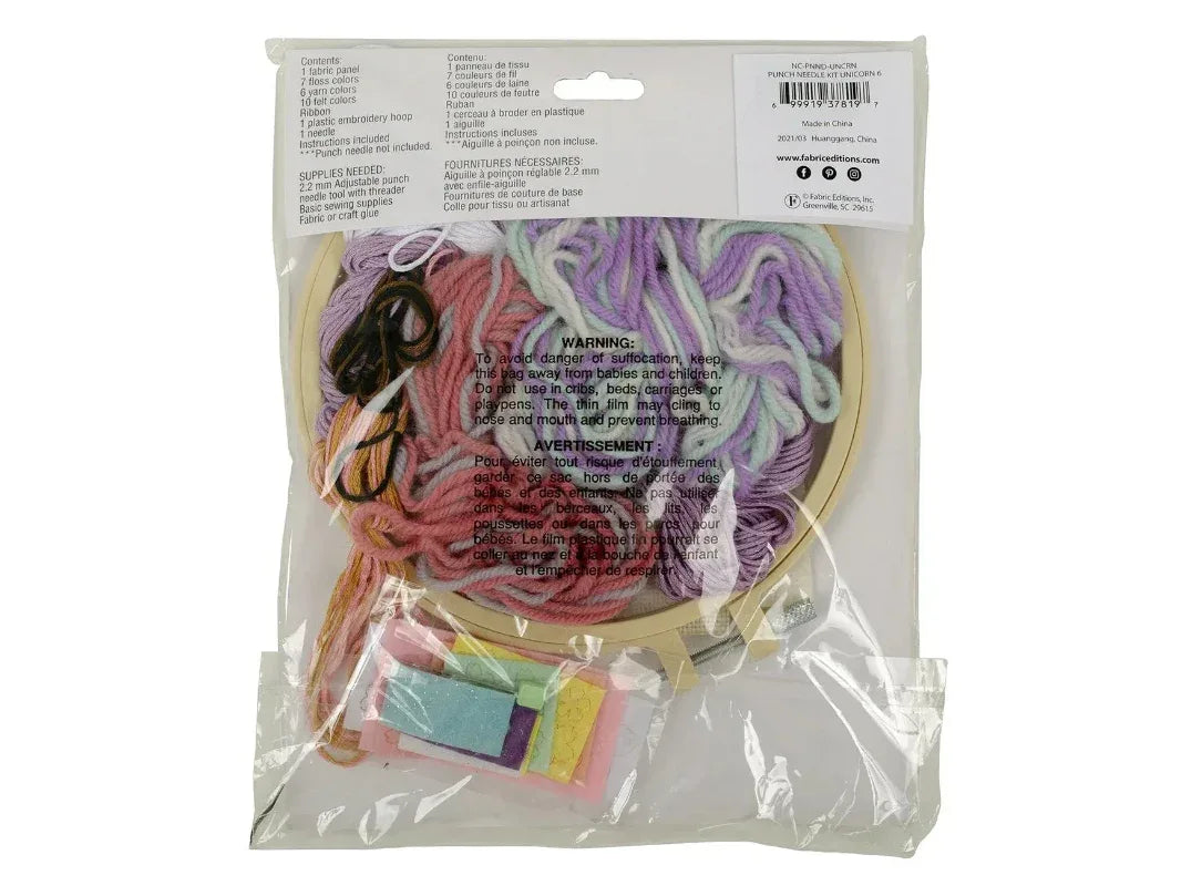 Packaged craft kit with yarn and embroidery hoop on a white background