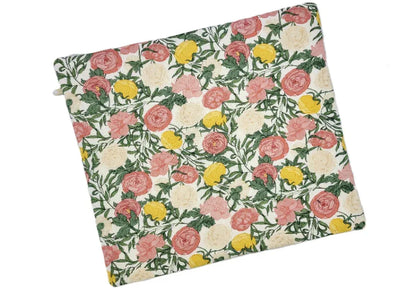 Floral patterned cushion cover with pink, yellow, and green flowers on a white background
