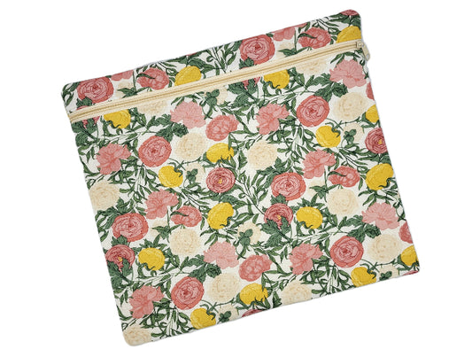 Floral patterned pouch with a zipper on a white background