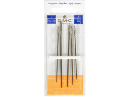 Set of DMC embroidery needles in a clear package on a white background