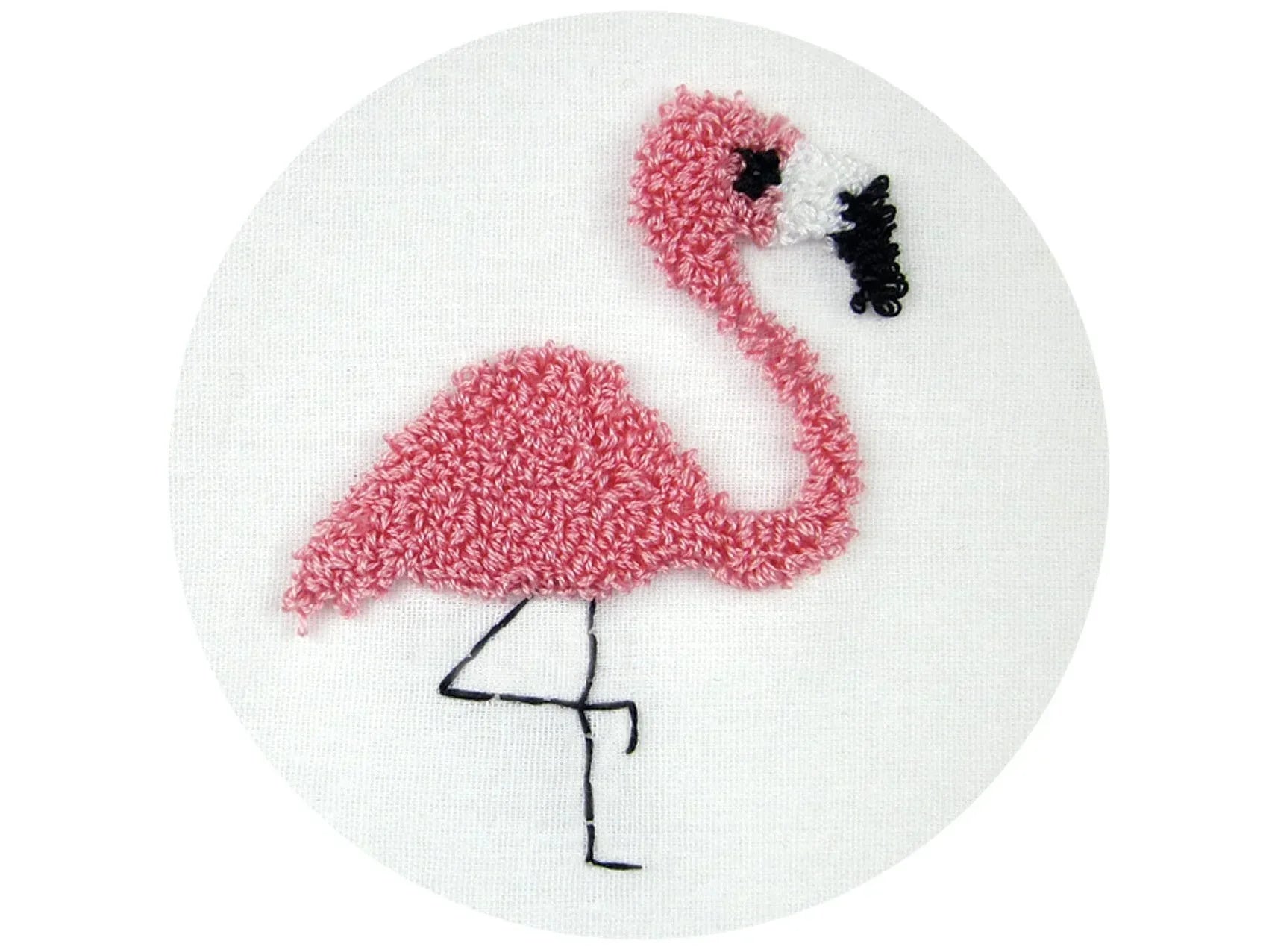 Pink flamingo plush toy on a white background