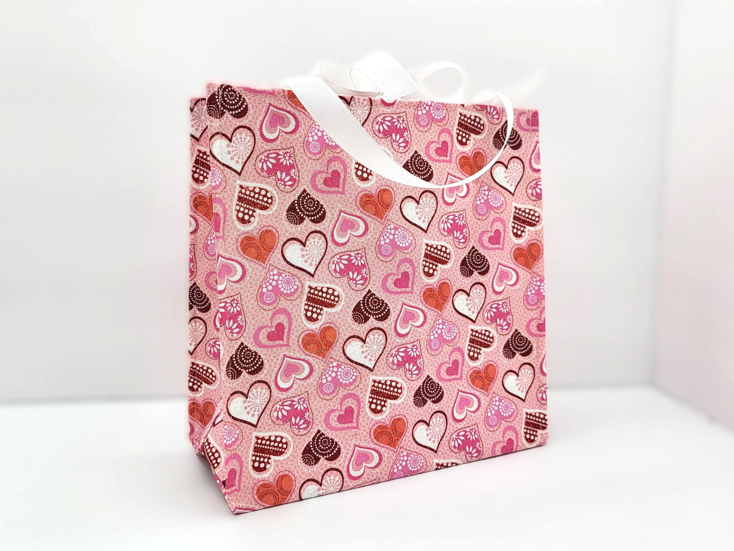 Small Reusable Fabric Valentine's Day Gift Bag with Ribbon tie and handles, Glitter Hearts, light