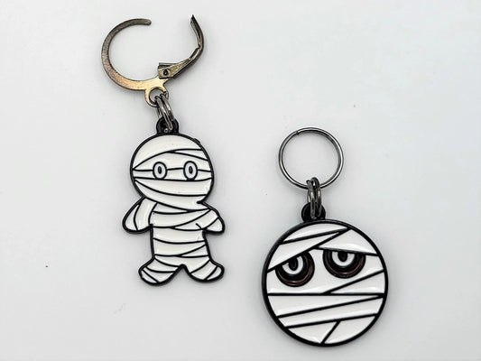 Halloween Mummy Stitch Markers 2pc set — both enamel charms included, flat lay